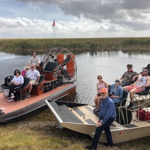 people inside airboat on lake