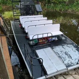a train cake sitting on top of a wooden fence