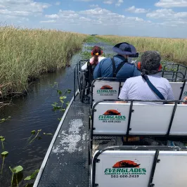 a group of people on a boat in the water