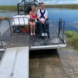 a person standing next to a body of water